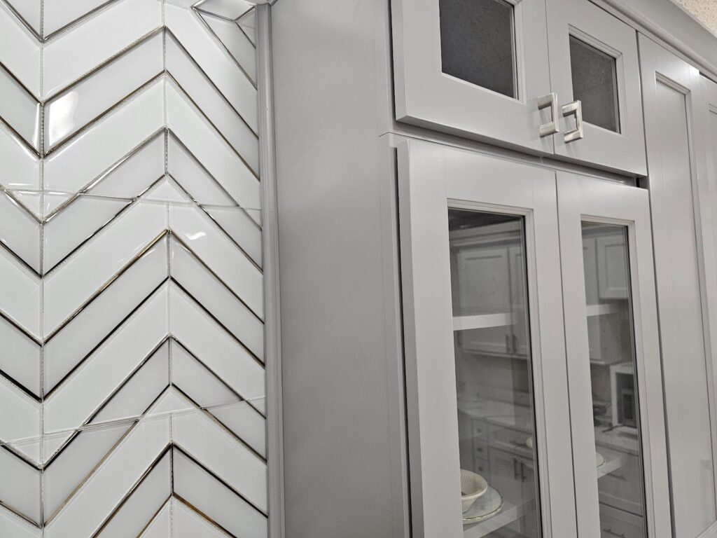 Sleek herringbone tile backsplash behind stove in Washington, DC kitchen