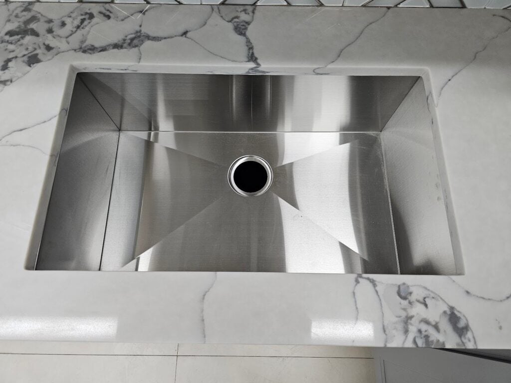 Close-up of modern double basin kitchen sink in Washington, DC interior