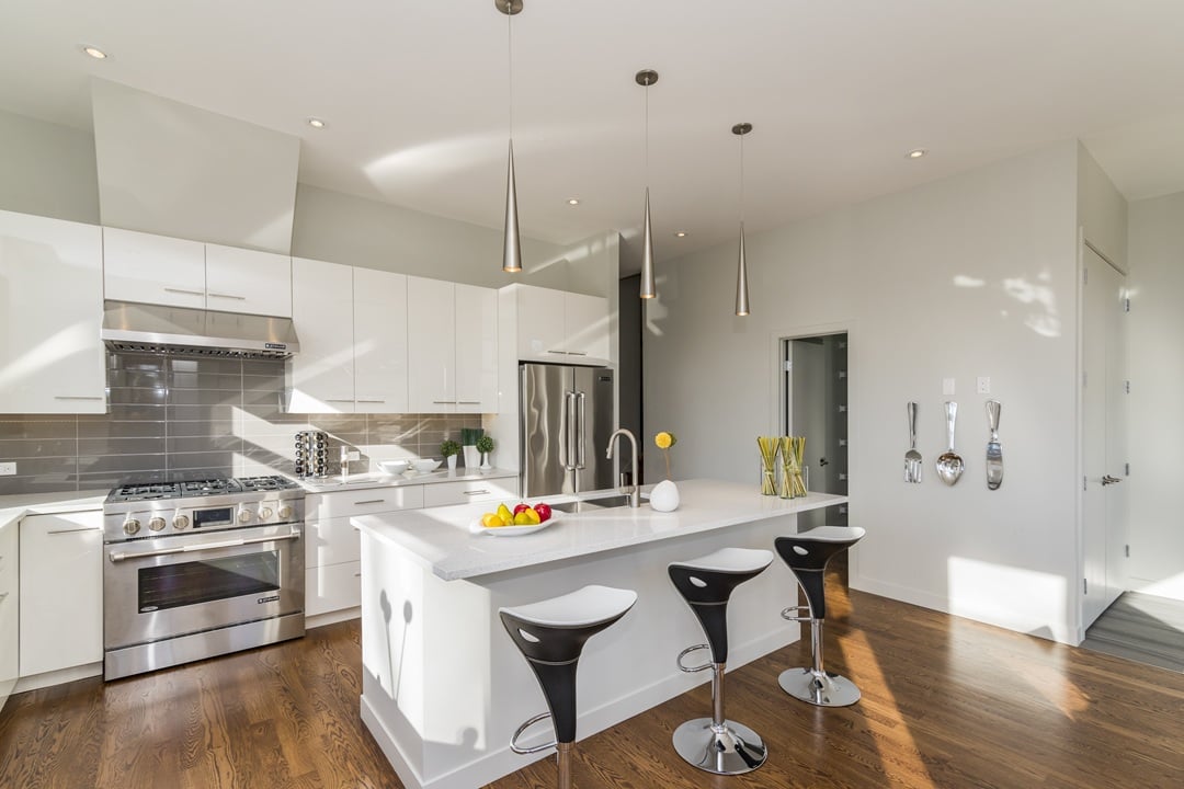 Open concept kitchen remodel in Washington DC rowhouse with modern island