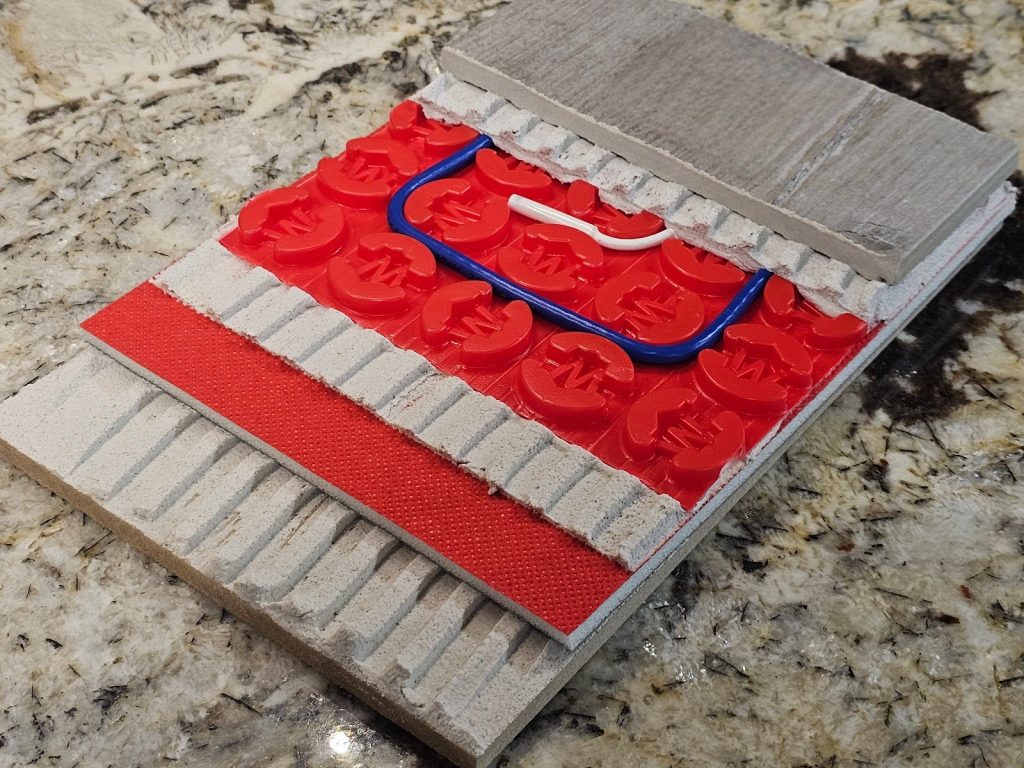 Close-up of electrically heated floor system under tiles