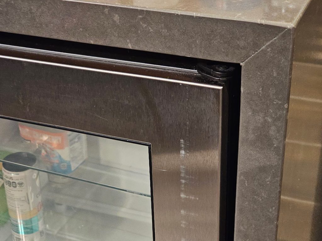 Countertop refrigerator with stainless steel finish in a modern kitchen