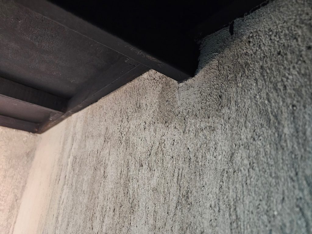 Applying cement finish on bathroom walls