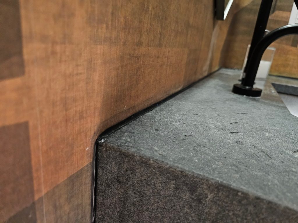 Chiaroscuro-inspired bathroom with contrasting tiles and fixtures