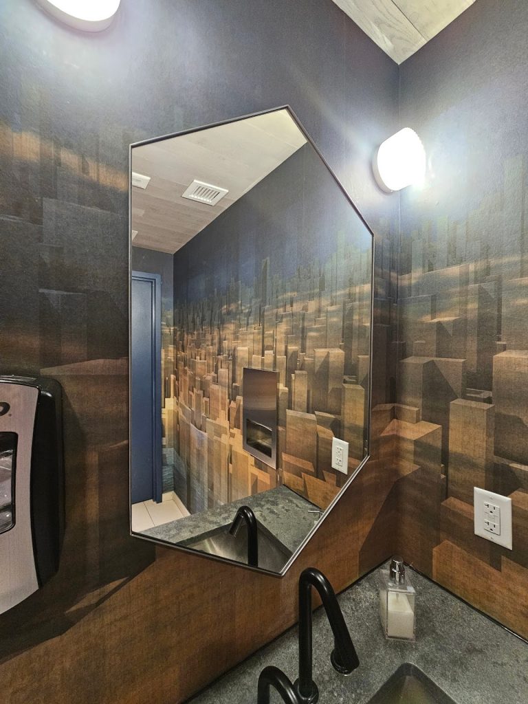 bathroom are positioned on both sides of the mirror