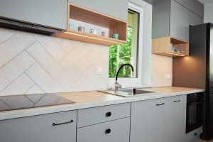 Gaithersburg homeowner maintaining cabinets and countertops in a recently renovated kitchen