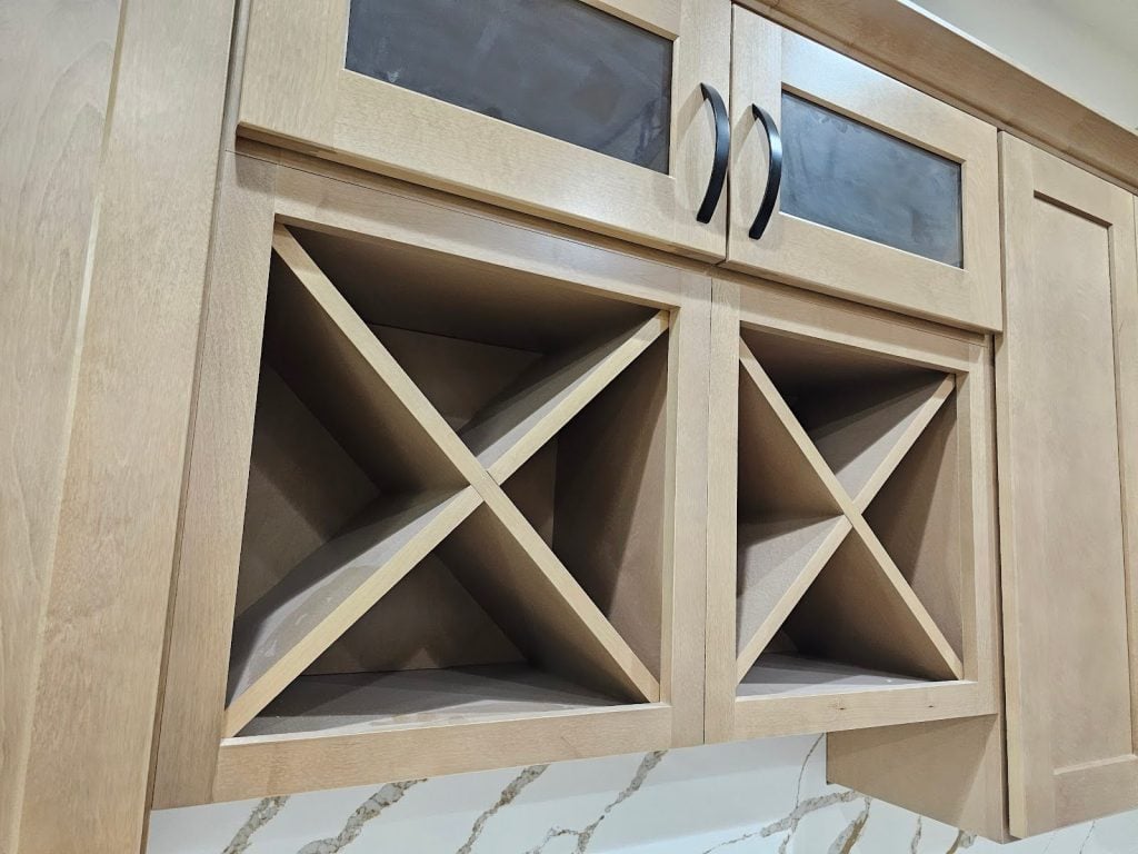 Close-up of natural wood grain shaker cabinets showing texture and finish details