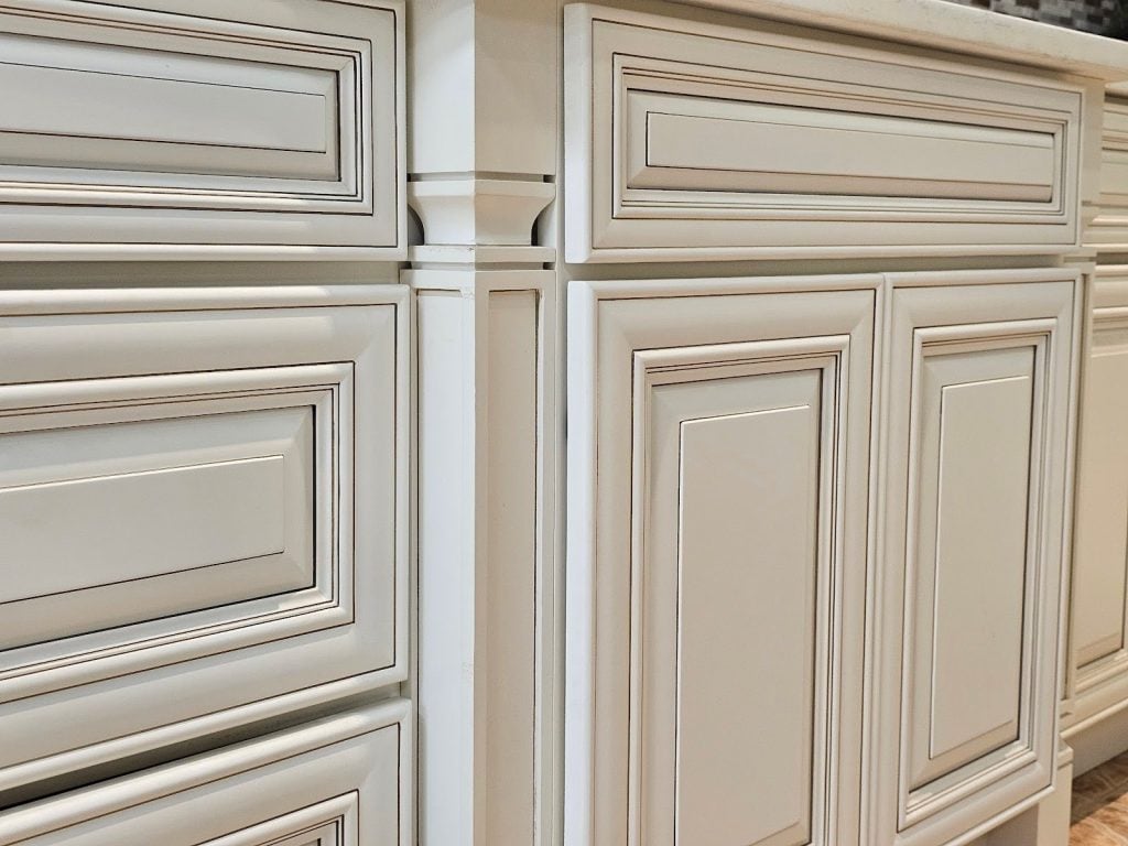 Elegant kitchen design with natural wood grain shaker cabinets and modern lighting