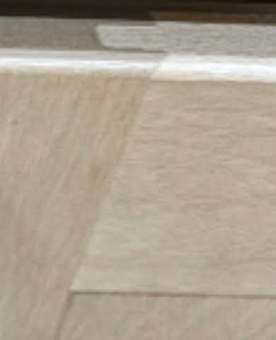 Light wood shaker cabinets in a contemporary kitchen with clean lines and storage