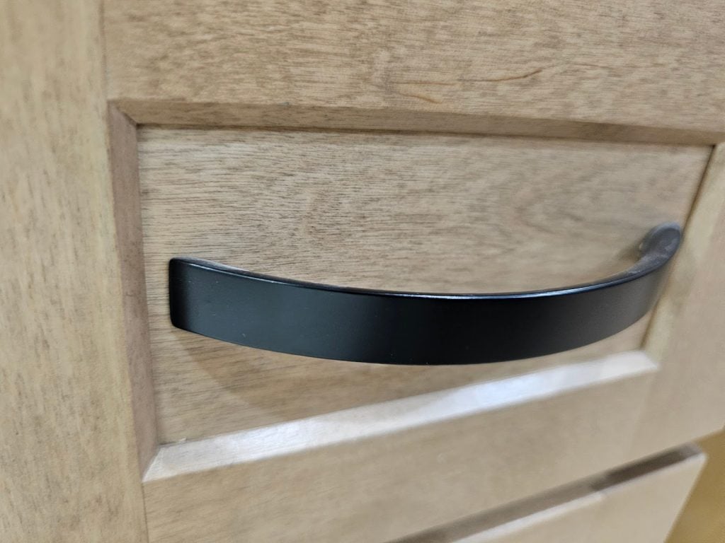 Warm-toned shaker style kitchen cabinets with natural wood grain finish