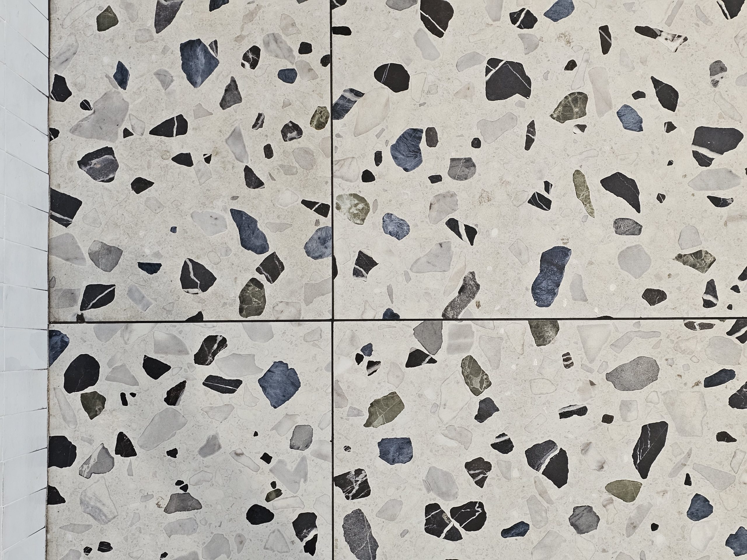 dark colored grout which complements the darkest colors of the tile