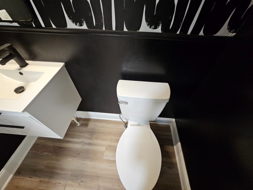 Custom accent wall creating a bold focal point in a remodeled bathroom