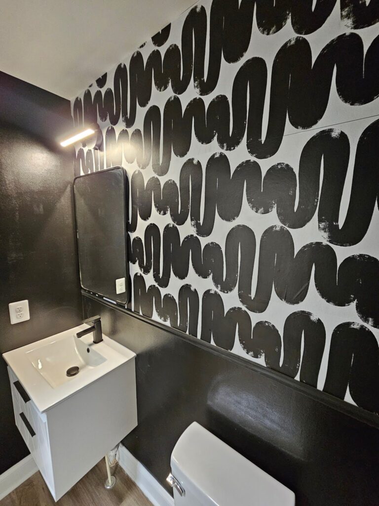Decorative accent wall adding texture and character to a contemporary bathroom