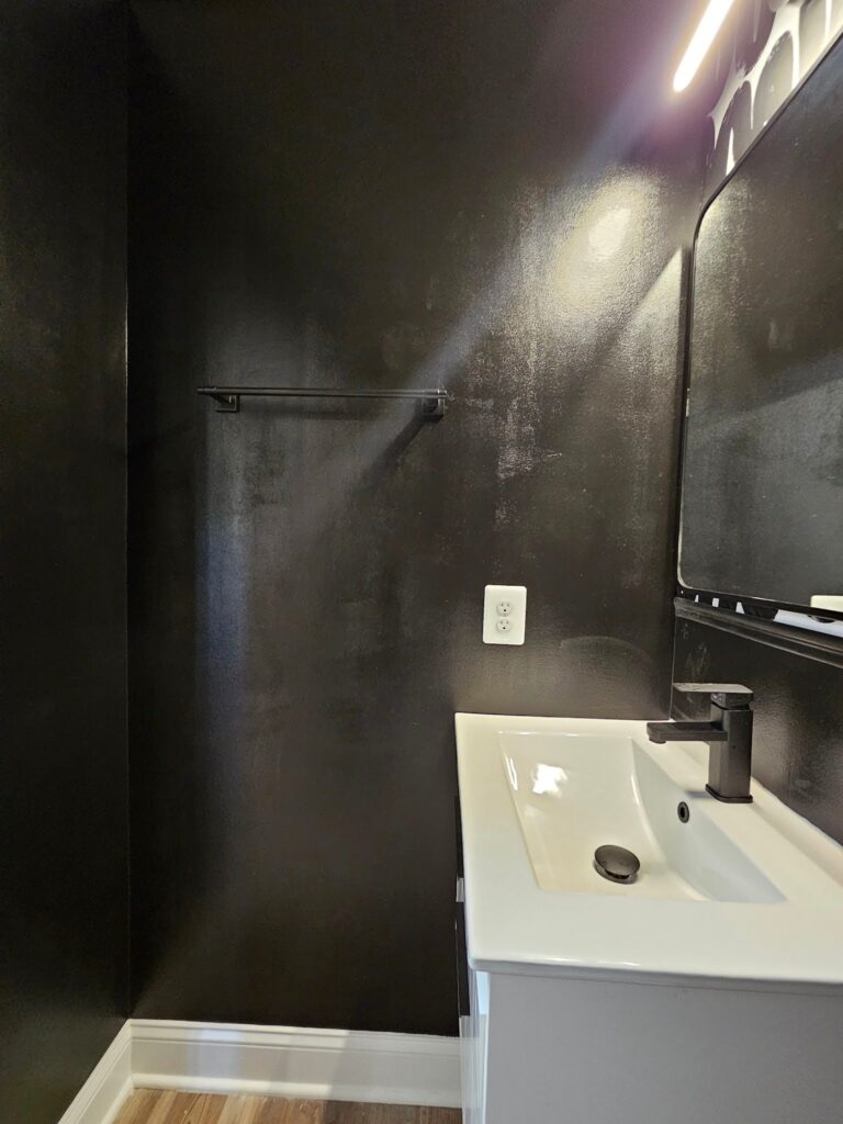 Elegant bathroom interior showcasing a textured wiggle-inspired feature wall