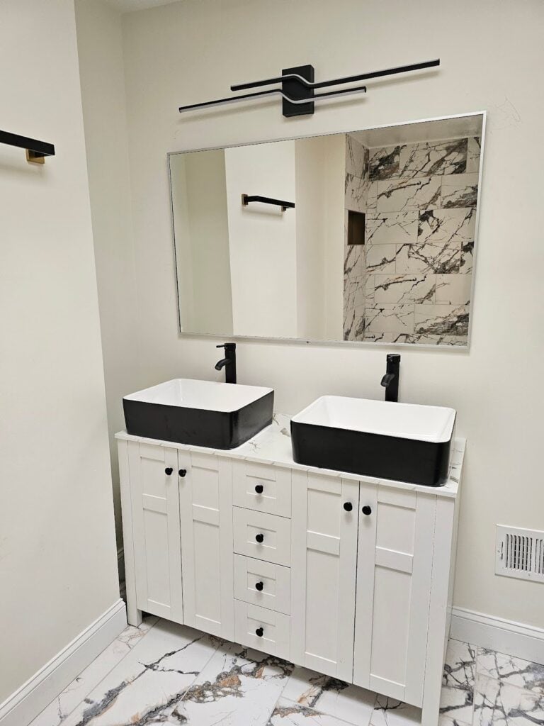 Contemporary black and white bathroom vanity featuring stylish storage and premium finishes
