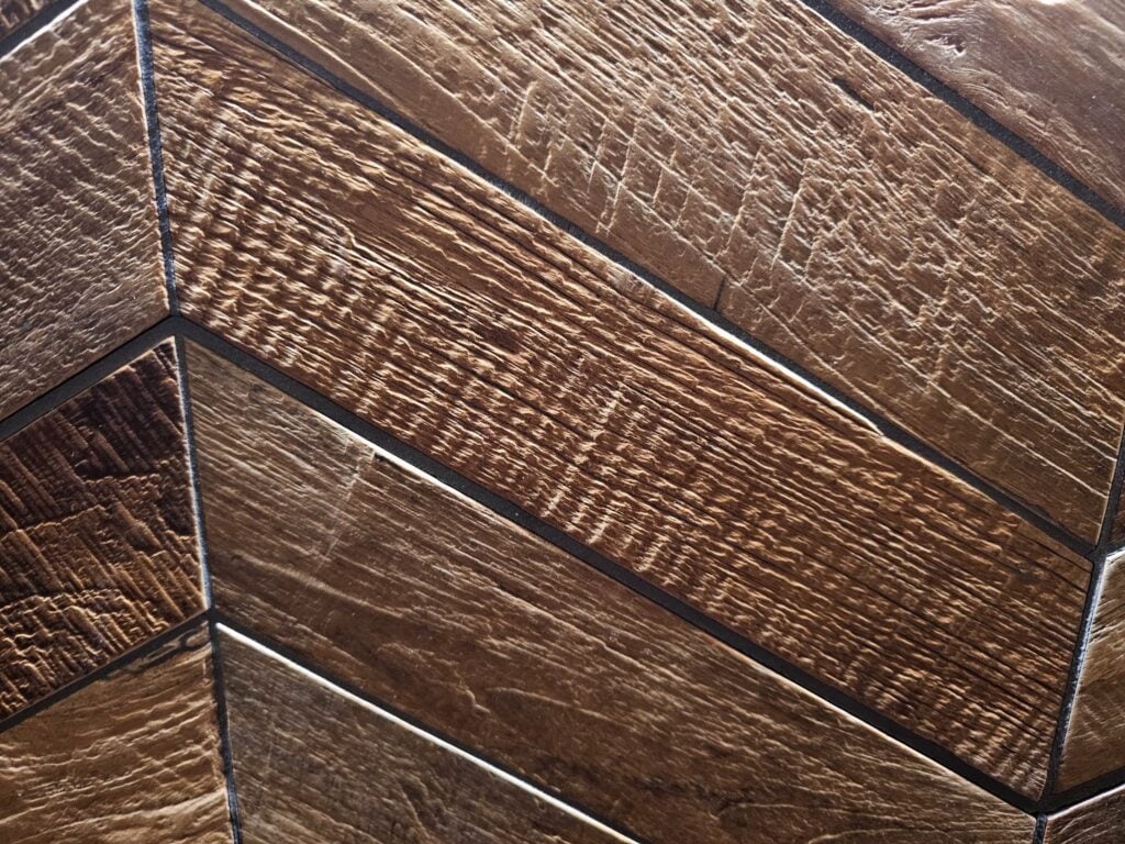 Finished herringbone pattern wood-like tile enhancing a contemporary interior