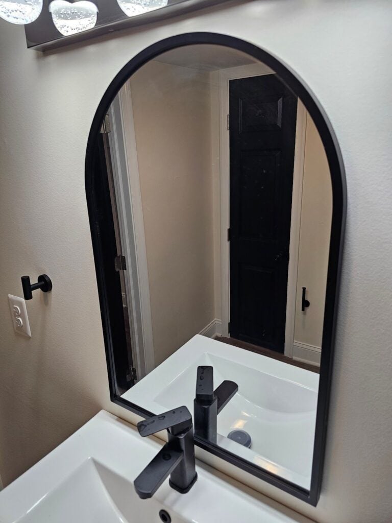 Modern black and white bathroom vanity with sleek cabinetry and elegant countertop design