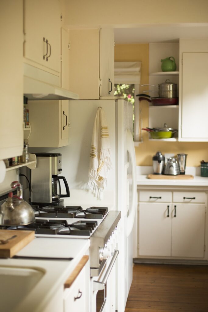 Homeowner planning a phased kitchen remodel to spread renovation costs over time in Montgomery County MD
