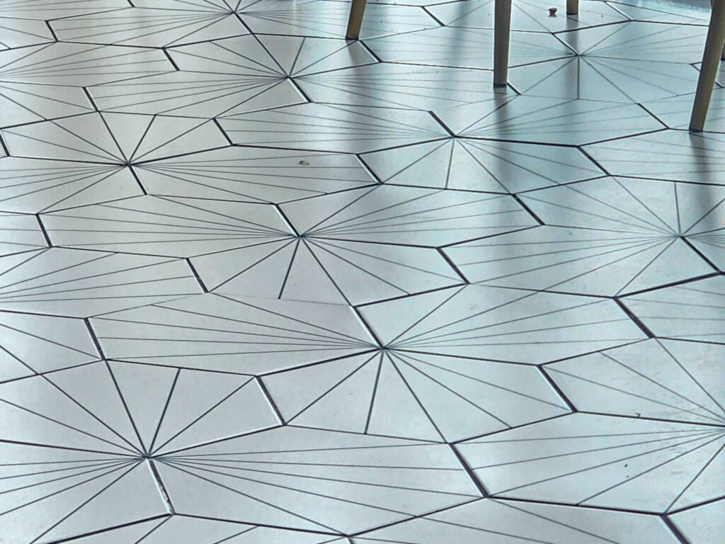 Art Deco style hex tile pattern with geometric decorative design