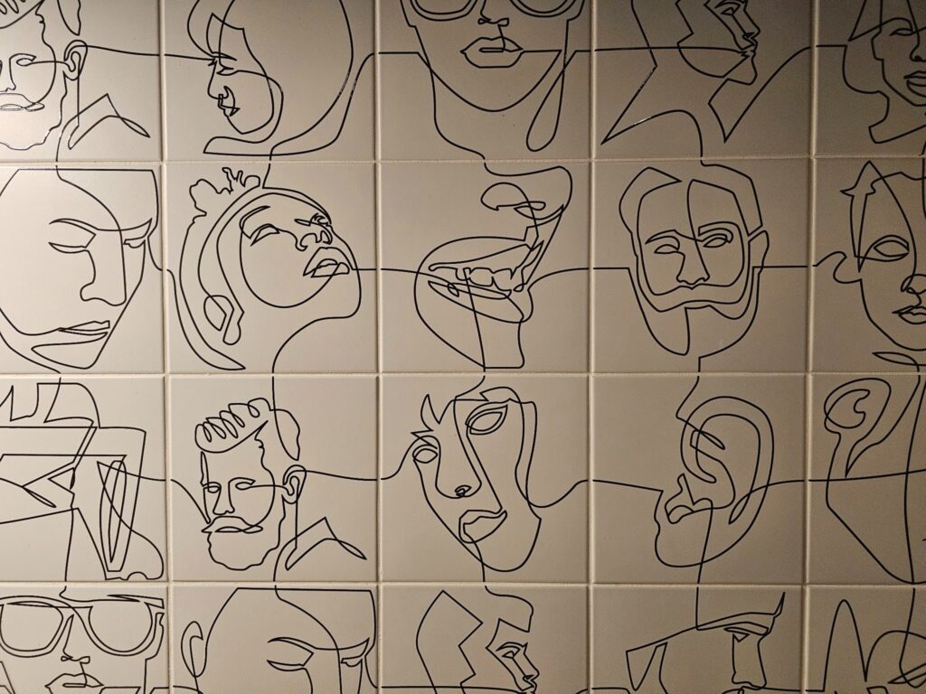 Decorative porcelain tile wall with minimalist line artwork