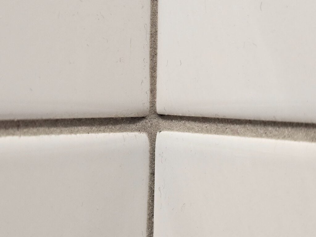 Modern bathroom with subway tile shower walls and fixtures