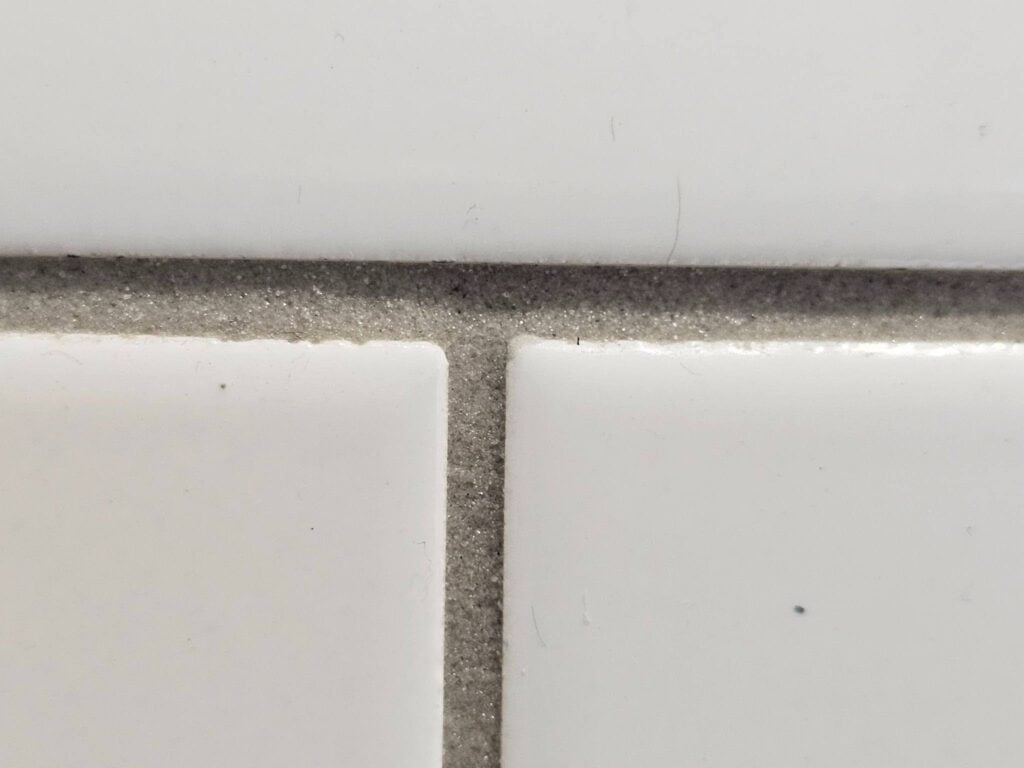 resist the force of packing the grout