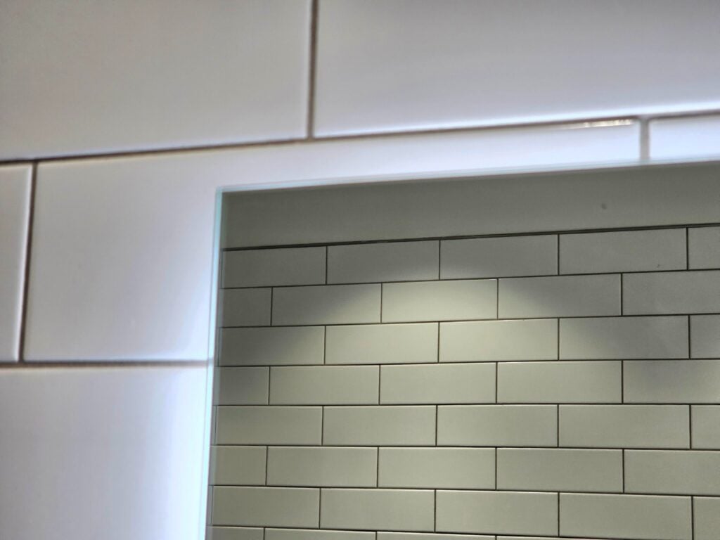 sand granules are chunky compared to the remainder of the components of the grout
